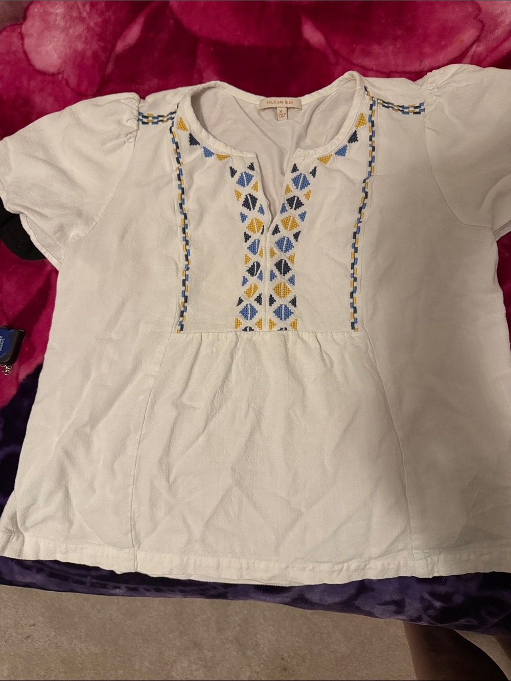 Skies Are Blue White Top with Gold Label Detail